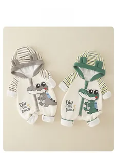 Detail of newborn baby hooded rompers featuring cute crocodile prints and striped patterns