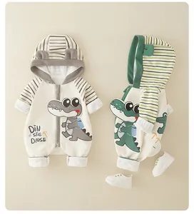 Detail of hooded baby romper with 3D ears and cartoon crocodile print on soft fabric