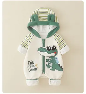 Detail of newborn baby crocodile romper with quilted fabric and hood ears