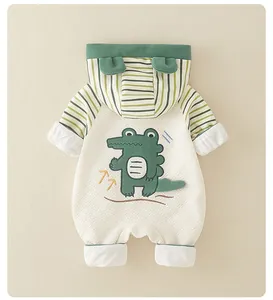 Detail of baby quilted cotton romper with cartoon crocodile and striped hood