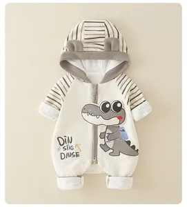Detail of baby romper featuring diamond quilt texture and cute cartoon dinosaur patch