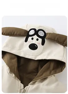 Close-up of kids hooded jacket featuring cute cartoon dog embroidery and 3D ear details