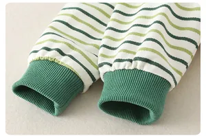 Detail shot of green and white striped long sleeves with ribbed cotton cuffs for infants