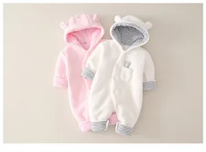 Close-up of soft flannel baby rompers with animal hood and bear embroidery detail