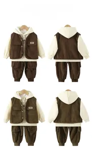 Detailed corduroy texture of toddler three-piece cargo set with vest and hoodie
