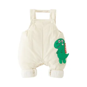 Salopette bébé en maille gaufrette avec broderie dinosaure vert en couleur crème