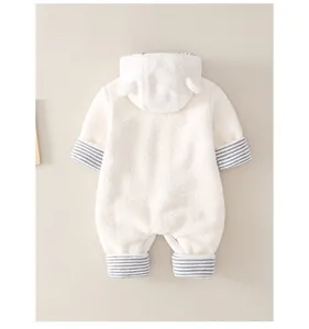 Detail of white hooded baby romper with cute bear ears and striped ribbed cuffs
