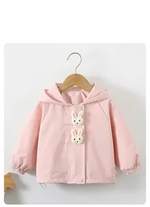Close-up of pink toddler jacket with cute 3D bunny dolls and elastic cuffs