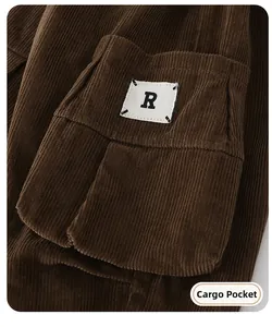 Detailed view of deep brown corduroy fabric featuring a cargo pocket and letter R tag