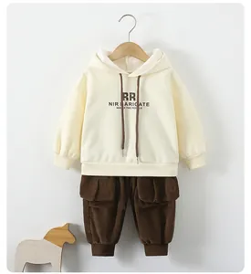 Detail of cream hoodie and brown corduroy cargo pants with utility pockets for boys