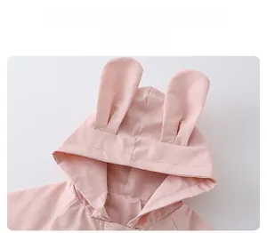 Detailed close-up of pink toddler windbreaker hood featuring cute 3D bunny ears design