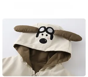 Detail of children hoodie showing the cartoon dog ears and pilot goggle embroidery