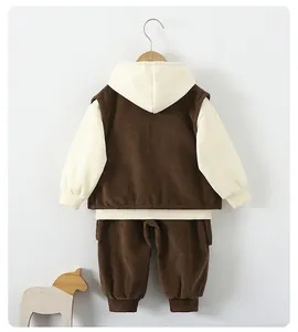 Detail view of corduroy texture on boy's two-piece hoodie and matching trousers set