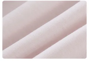 Close-up of soft light pink knit fabric texture for children's jacket lining