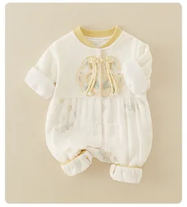Detailed view of traditional Chinese embroidery and knots on baby cotton romper