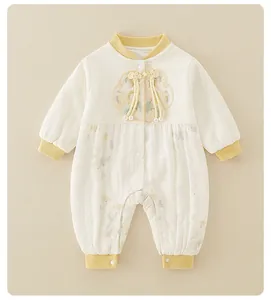 Close-up of traditional Chinese embroidery and knots on a baby romper with floral patterns