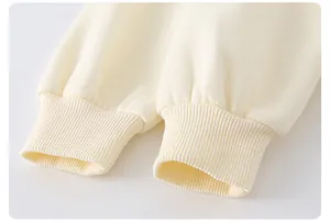 Detail of cream cotton knit sleeves featuring high-quality ribbed cuffs for kids outfits