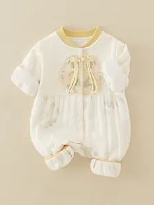 Chinese style baby romper with floral embroidery and traditional yellow buttons
