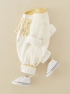 Chinese style baby girls rompers with floral embroidery and pearl tassel in cream white