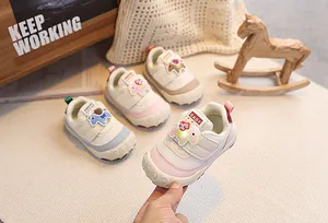 Close-up of baby sneakers with soft soles, breathable mesh and light-up pony detail