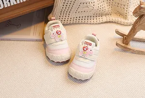 Detail view of baby walking shoes with mesh fabric and pink horse velcro closure