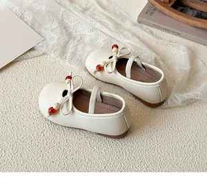 Detailed macro view of cream Mary Jane shoes with bow decoration and pearl accents