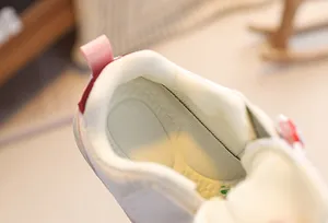 Close-up of baby sneaker interior with breathable mesh lining and non-slip textured insole