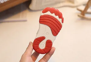 Detailed macro shot of non-slip rubber sole with size 17 marking on baby walking shoes