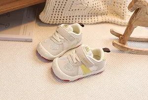 Detail of breathable mesh toddler sneakers with velcro closure and non-slip rubber sole