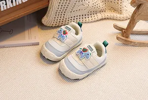 Detail of toddler walking shoes featuring velcro closure and protective round toe cap