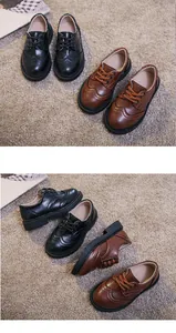 Detail of kids brogue oxford shoes featuring elegant carved patterns and durable thick soles