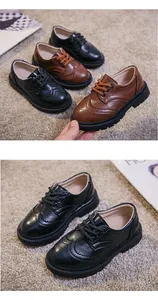 Close-up of brogue carving details on classic black and brown leather shoes for kids