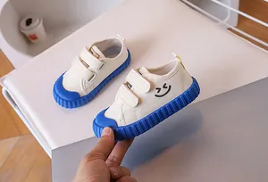 Detail of kids canvas shoes with royal blue anti-slip rubber sole and double velcro straps