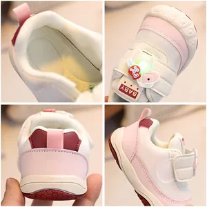 Pink and white toddler sneakers with glowing elephant detail and anti-slip rubber soles
