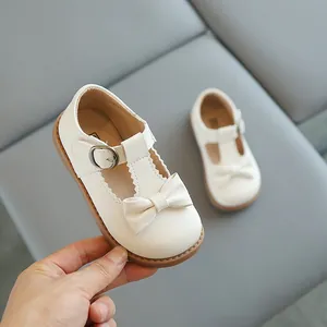 Chaussures Mary Jane beiges pour filles avec bride en T et nœud sur semelle antidérapante