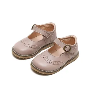 Pink Mary Jane baby shoes with classic brogue cutout patterns and durable rubber soles