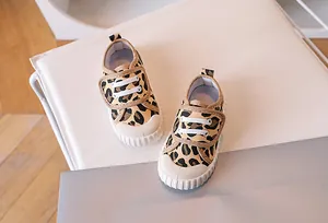 Detail of toddler leopard print canvas shoes with hook-and-loop straps and rubber toes