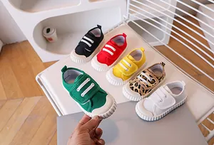 Detail of colorful children canvas shoes with secure velcro straps and rubber toe caps