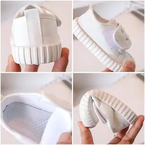 Classic white kids canvas shoes with velcro straps and flexible anti-slip rubber soles