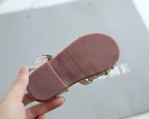 Close-up of non-slip rubber sole for toddler sandals with size 23 fashion marking