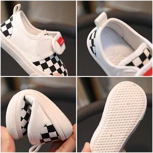 Kids checkerboard canvas shoes with flexible rubber sole and red logo tag detail