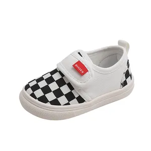 Kids checkerboard canvas sneakers with velcro straps and non-slip rubber soles