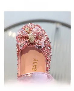 Detail display of pink sequin girls flat shoes with crystal bow and anti-collision toe