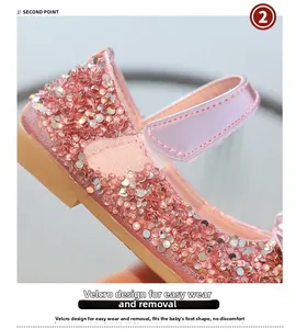 Detail of pink sequin Mary Jane shoes showing adjustable hook-and-loop strap for a secure fit