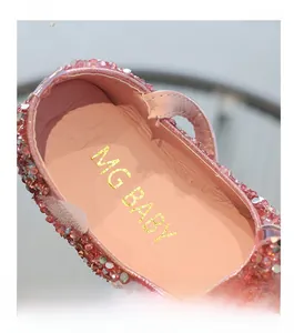 Detail of pink sequin Mary Jane shoes showing soft skin-friendly inner lining and logo