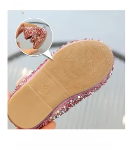 Detailed view of pink sparkling girls' shoes featuring non-slip wear-resistant rubber soles