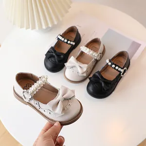Girls Mary Jane shoes with pearls, bows and heart cutouts in beige and black colors