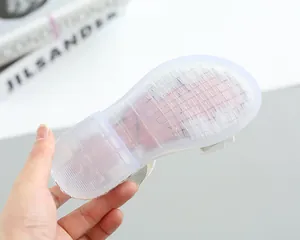 Detail of girls princess sandals showing the anti-slip jelly sole with grid pattern
