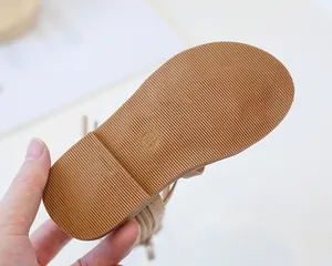 Detail of non-slip rubber sole for children sandals showing size 23 and 165mm marking