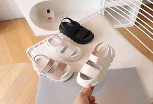 Detailed view of child's closed-toe summer sandals in beige, khaki, black and cream white